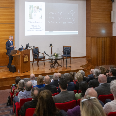 Professor Sir David MacMillan presenting at a previous leadership lecture.